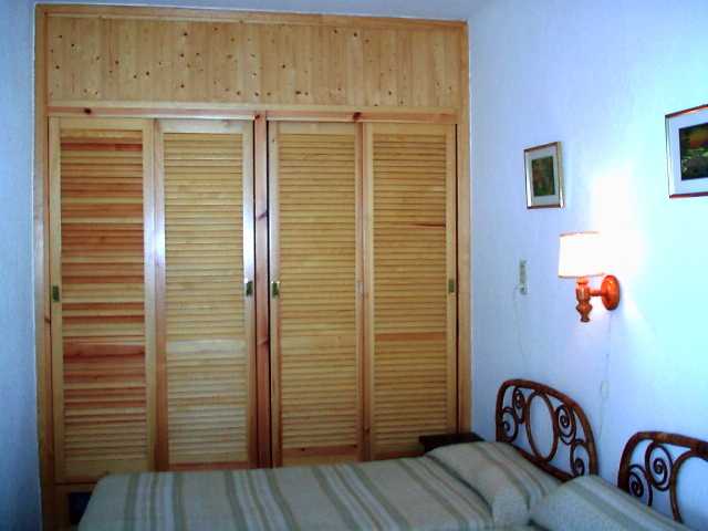 bed room with 2 single beds and large wardrobe