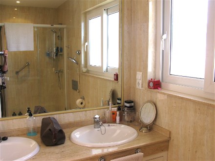 This en Suite Bath room has doble sinks and a large shower cubicle